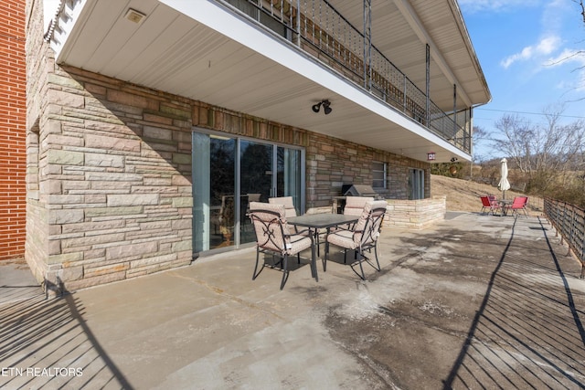 view of patio / terrace with a balcony