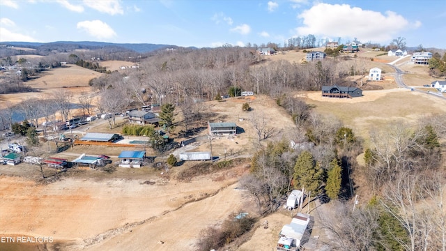 birds eye view of property featuring a rural view