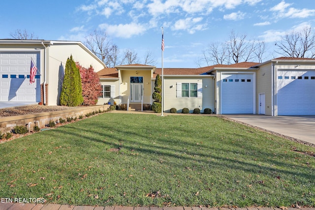 single story home with a garage and a front yard