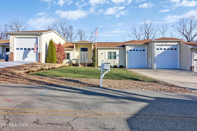 single story home with a garage and a front yard