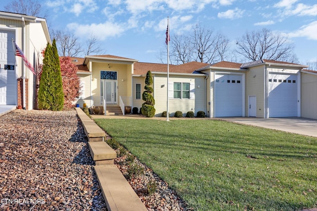 ranch-style house featuring a garage and a front yard