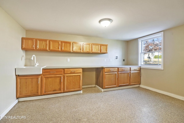 kitchen with sink and built in desk