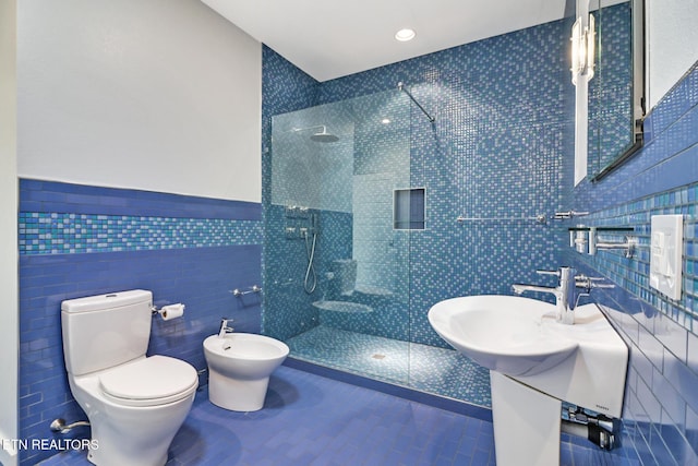 bathroom featuring a bidet, a tile shower, tile walls, and toilet