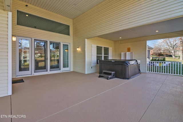 view of patio / terrace with a hot tub