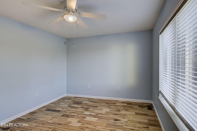 unfurnished room featuring ceiling fan and light hardwood / wood-style flooring