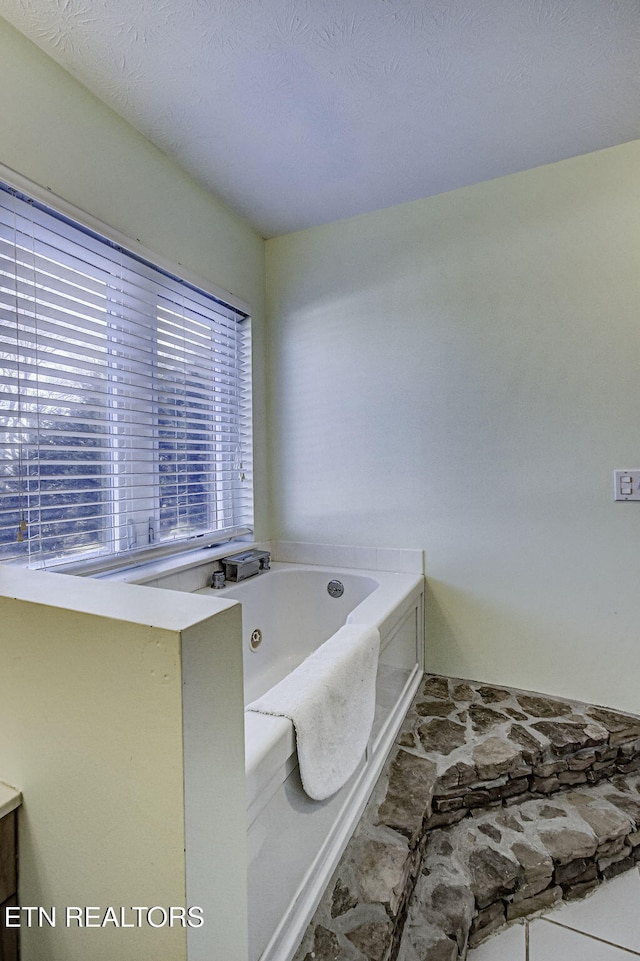 bathroom with a tub