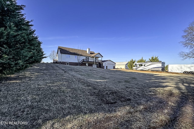 view of front of house with a garage and a front yard