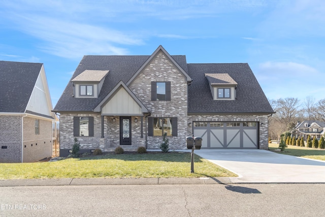 view of front of property with a garage and a front lawn