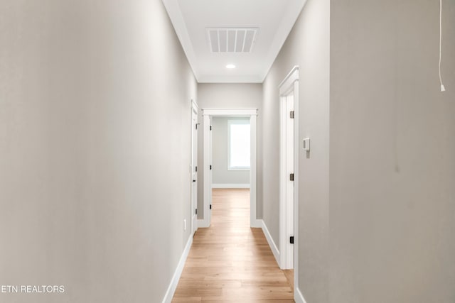 hall with light wood-type flooring