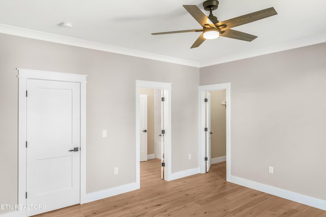 unfurnished bedroom featuring ceiling fan, ornamental molding, and light hardwood / wood-style flooring