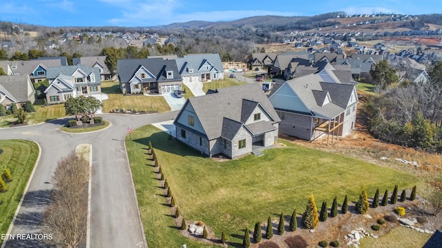 drone / aerial view featuring a mountain view