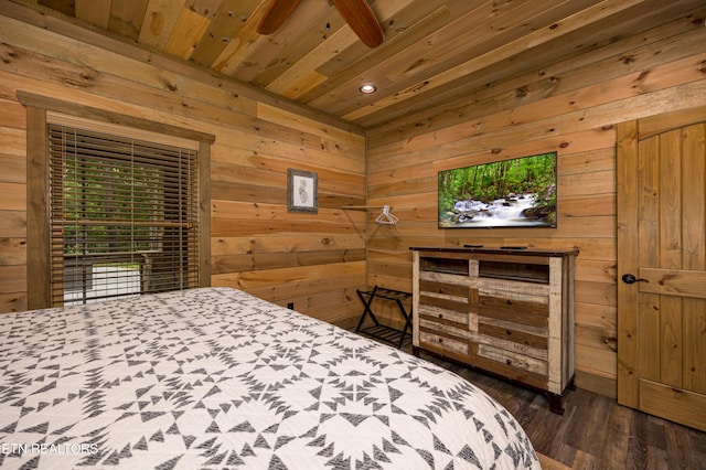 bedroom featuring dark hardwood / wood-style floors, wooden walls, and wooden ceiling