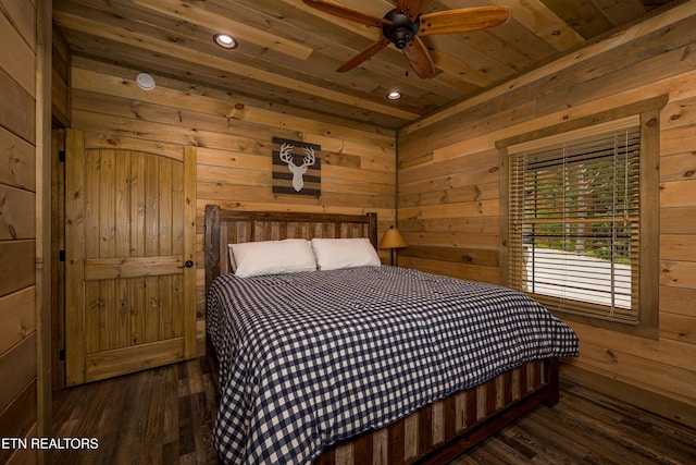 bedroom featuring wooden ceiling, dark hardwood / wood-style flooring, and wood walls