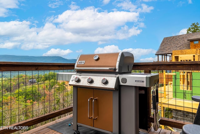 exterior space with a mountain view and a grill