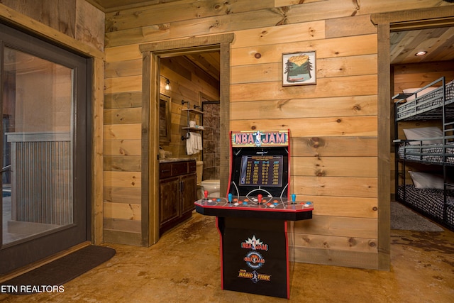 interior space with wooden walls and concrete floors