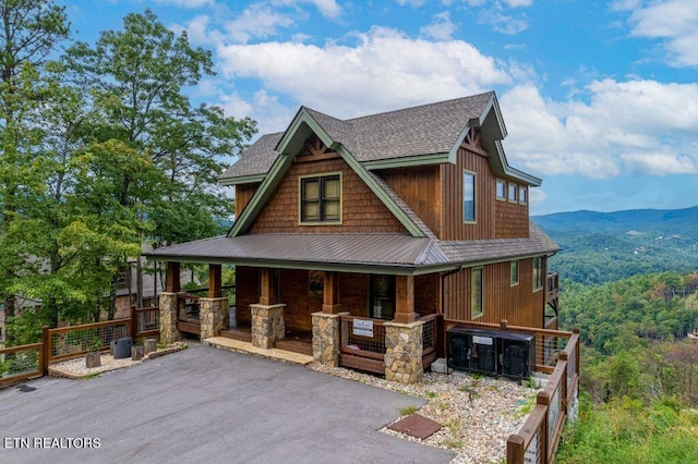 craftsman house featuring a mountain view and covered porch