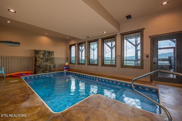 view of swimming pool with a jacuzzi