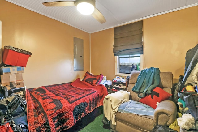 bedroom featuring crown molding, ceiling fan, and electric panel