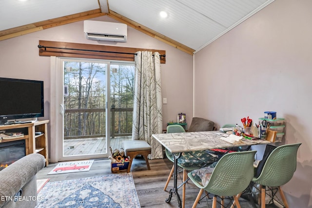 dining space with vaulted ceiling with beams, wood-type flooring, and an AC wall unit