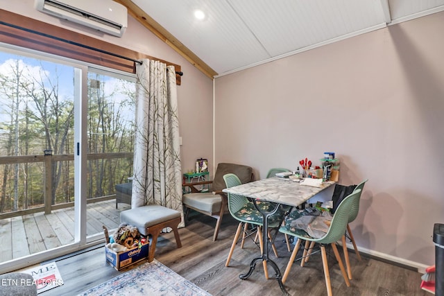 dining room featuring a wall mounted air conditioner, vaulted ceiling, and wood-type flooring