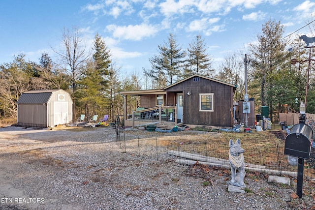 view of front of property with a shed