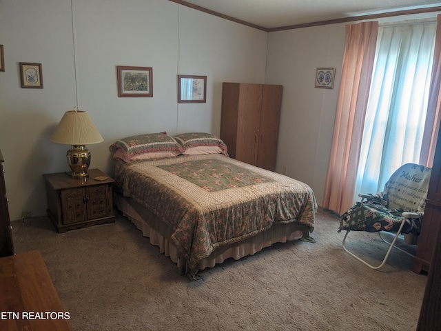 bedroom with crown molding and carpet