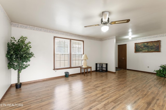 unfurnished room featuring hardwood / wood-style flooring and ceiling fan