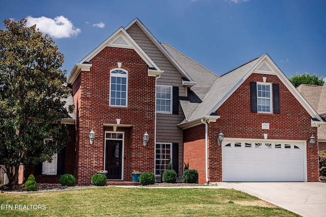 front of property with a garage and a front lawn