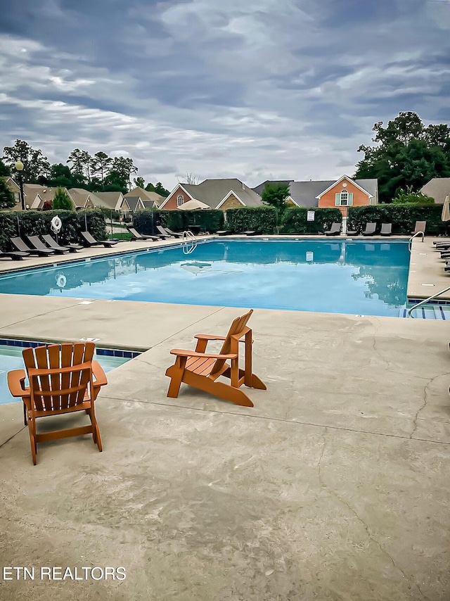 view of pool featuring a patio area