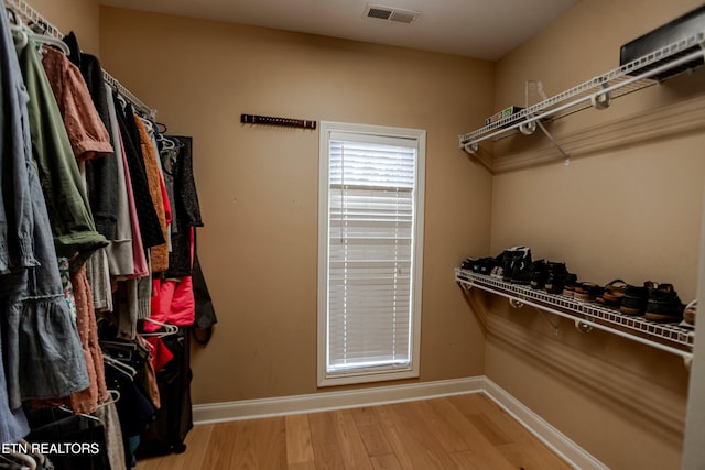 spacious closet featuring hardwood / wood-style flooring