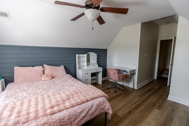 bedroom featuring dark wood-type flooring, ceiling fan, and lofted ceiling