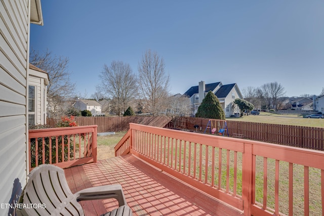 wooden terrace with a yard