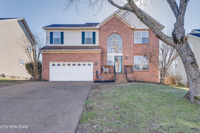 view of property featuring a garage and a front yard