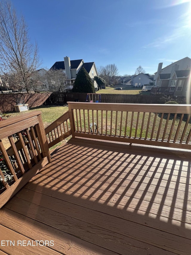 wooden deck with a yard