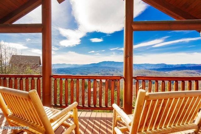 wooden deck featuring a mountain view