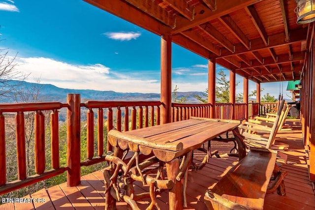 wooden deck featuring a mountain view