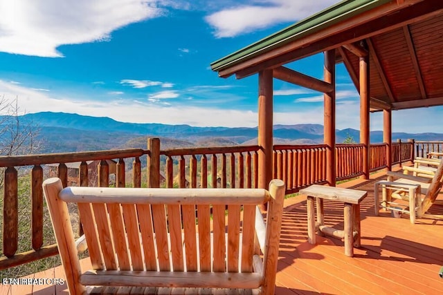 wooden terrace with a mountain view