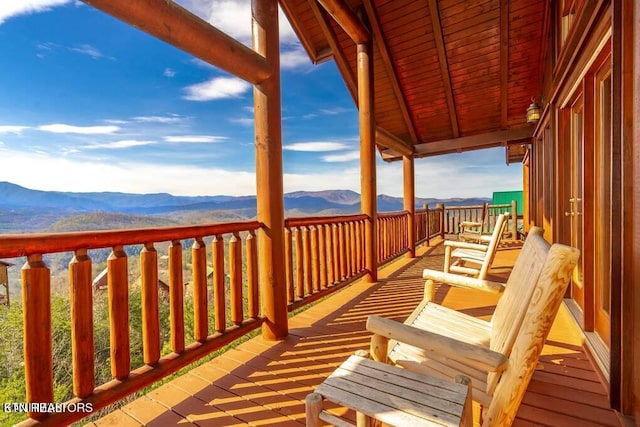 wooden terrace featuring a mountain view