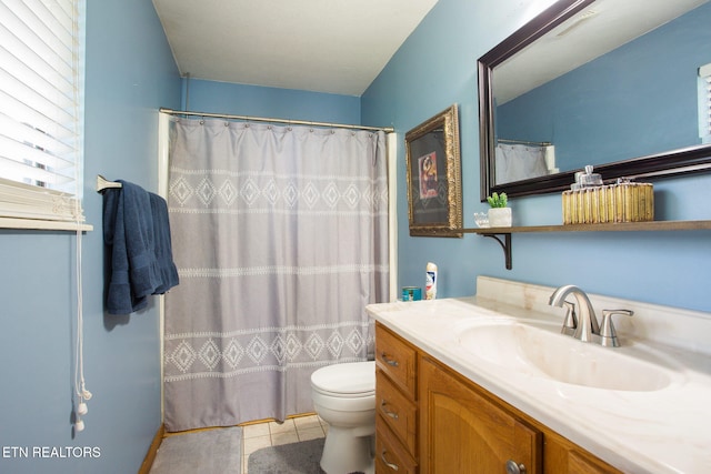 bathroom featuring tile patterned flooring, vanity, toilet, and a shower with shower curtain