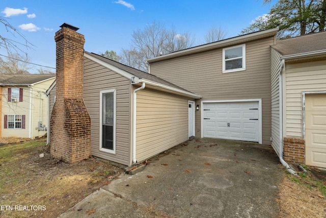 view of side of home with a garage