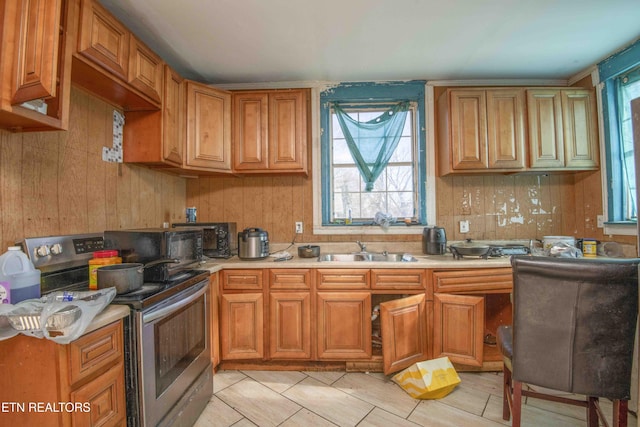 kitchen with sink and electric range