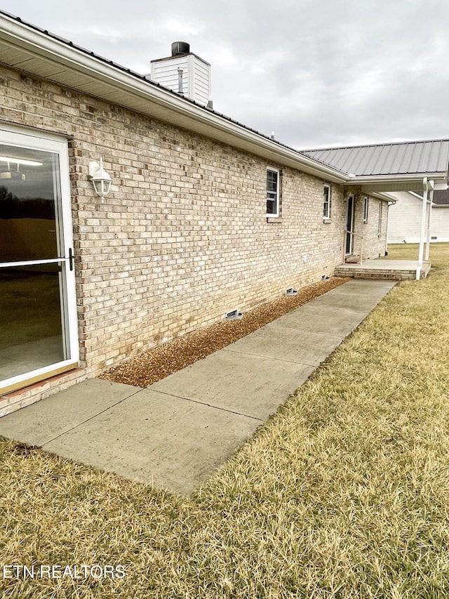 view of home's exterior with a lawn