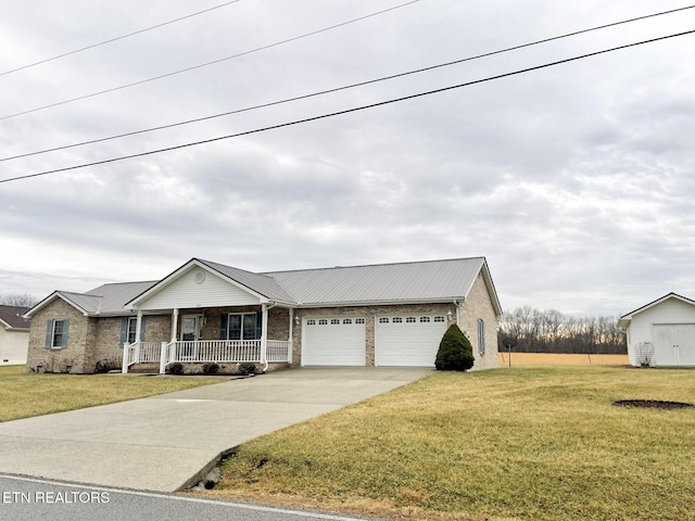 ranch-style house featuring a garage, a front lawn, and covered porch