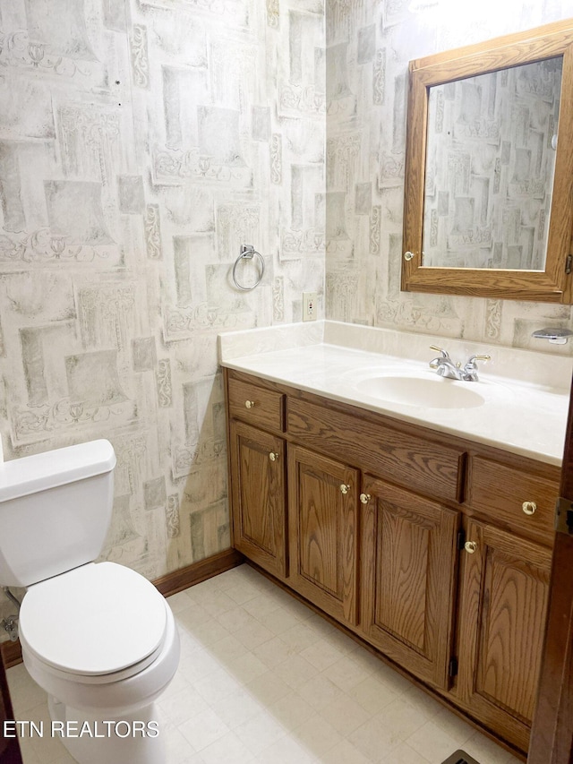 bathroom with vanity and toilet