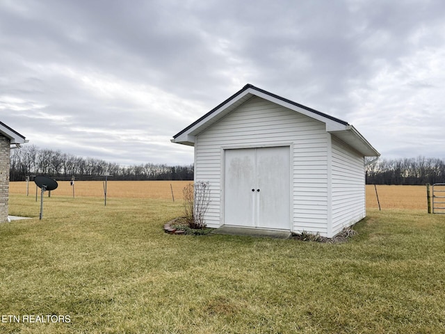 view of outdoor structure with a lawn