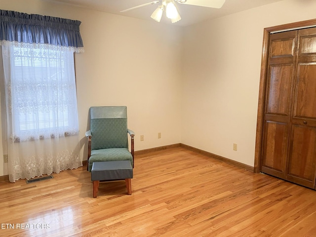 unfurnished room with ceiling fan, light hardwood / wood-style floors, and a wealth of natural light