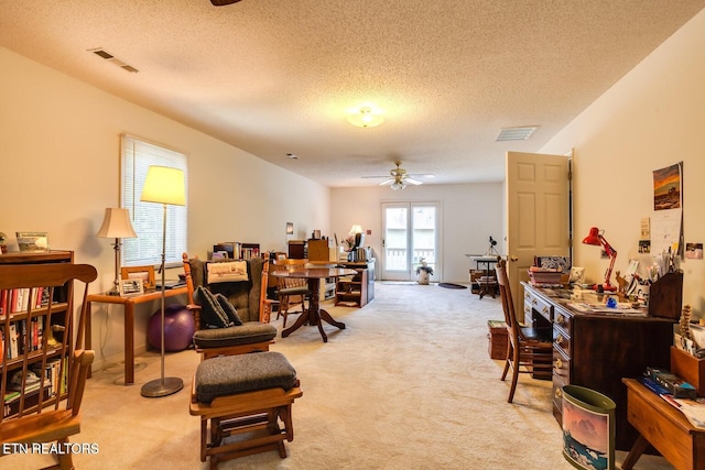 interior space featuring ceiling fan and a textured ceiling