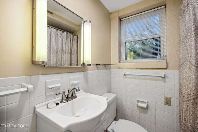 3516 Bluff Point Dr, Knoxville, TN 37920 - bathroom with tile walls, a wainscoted wall, toilet, and vanity