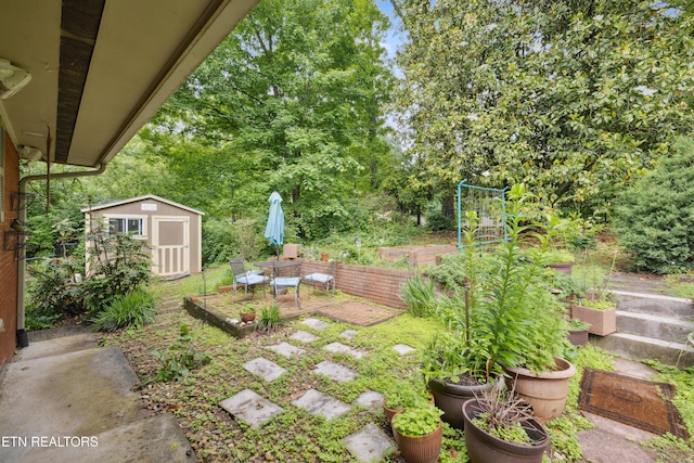 3516 Bluff Point Dr, Knoxville, TN 37920 - view of yard with a shed, an outdoor structure, a patio, and a vegetable garden