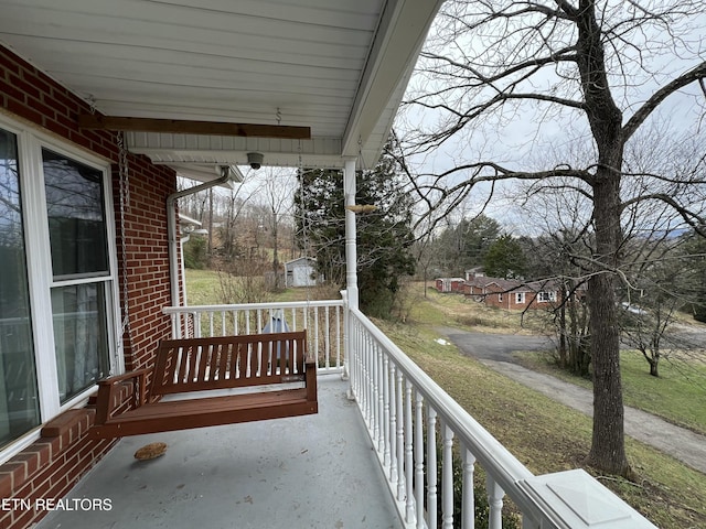 balcony featuring covered porch